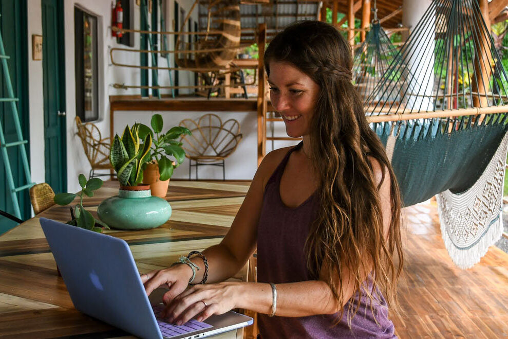 Digital nomad working in a cabin
